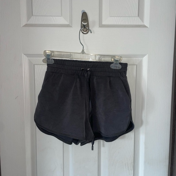 Black Athletic Shorts with Elastic Waistband and Curved Hem - Picture 1 of 4